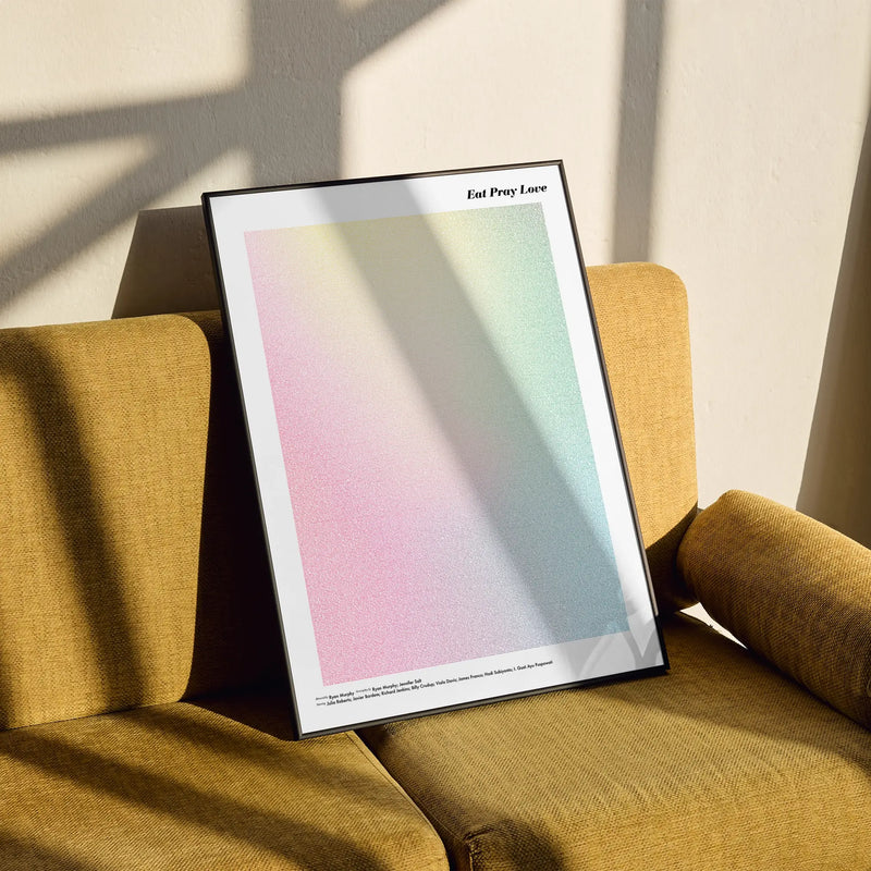 A framed Eat Pray Love movie script poster styled in a clean interior setting.