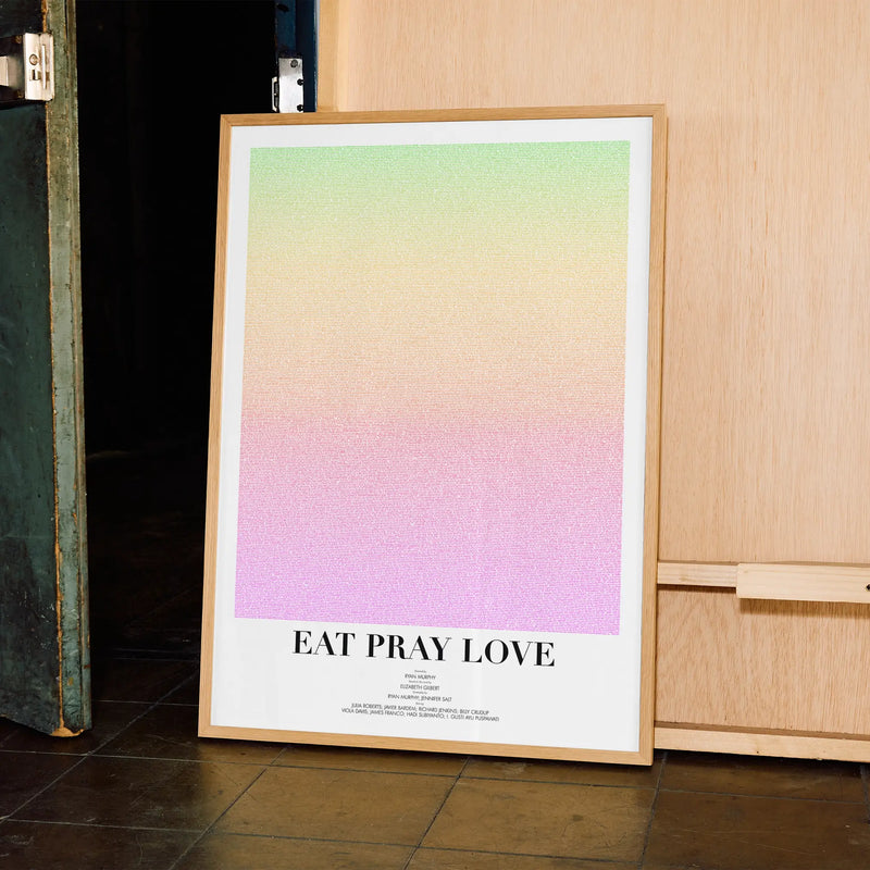 A framed Eat Pray Love movie script poster displayed in a contemporary interior setting.