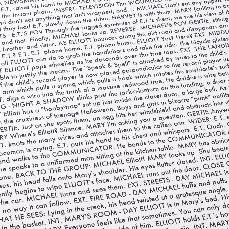 Close-up detail of the E.T. the Extra-Terrestrial movie script poster showing dense typographic text.