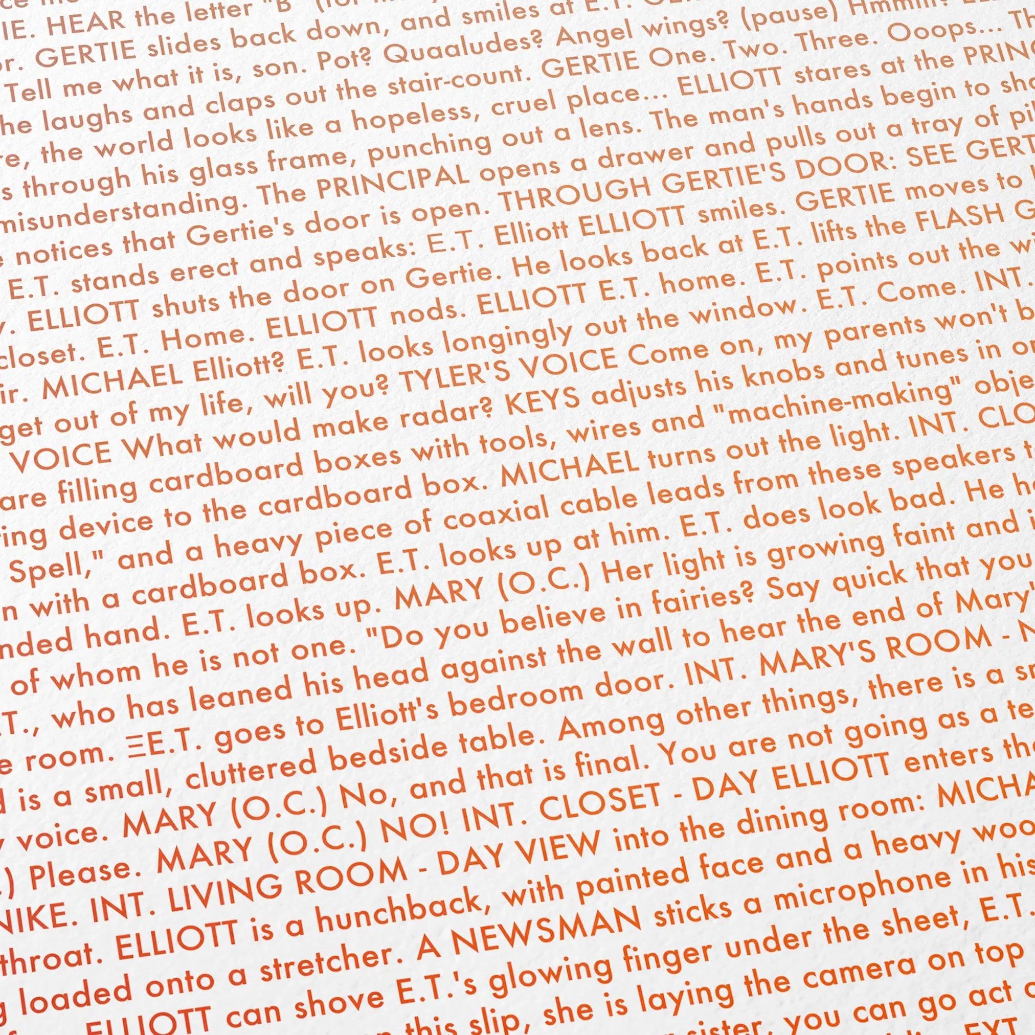 Close-up detail of the E.T. the Extra-Terrestrial movie script poster showing dense typographic text.