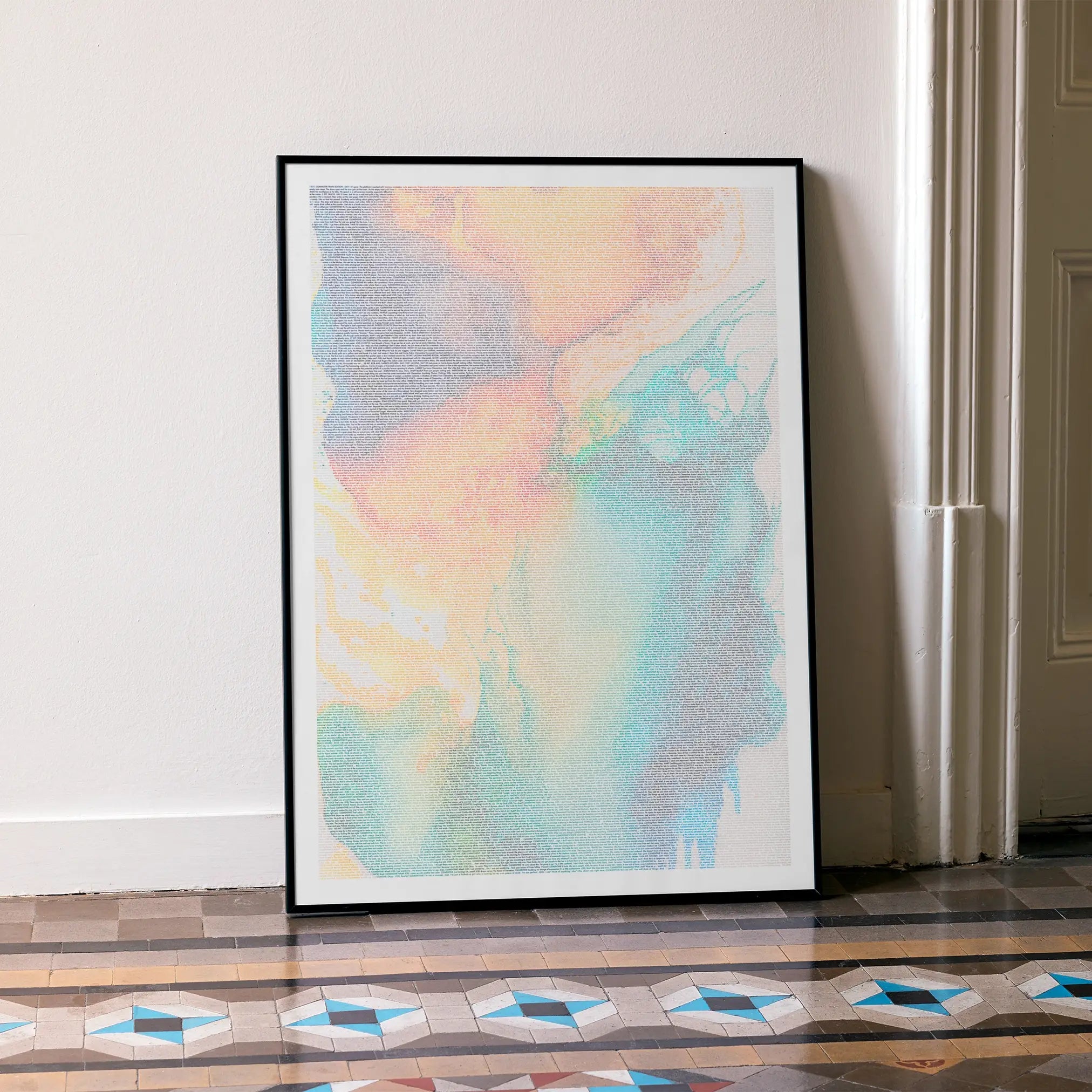 A framed Eternal Sunshine of the Spotless Mind movie script poster leaning against a wall in a minimalist interior.