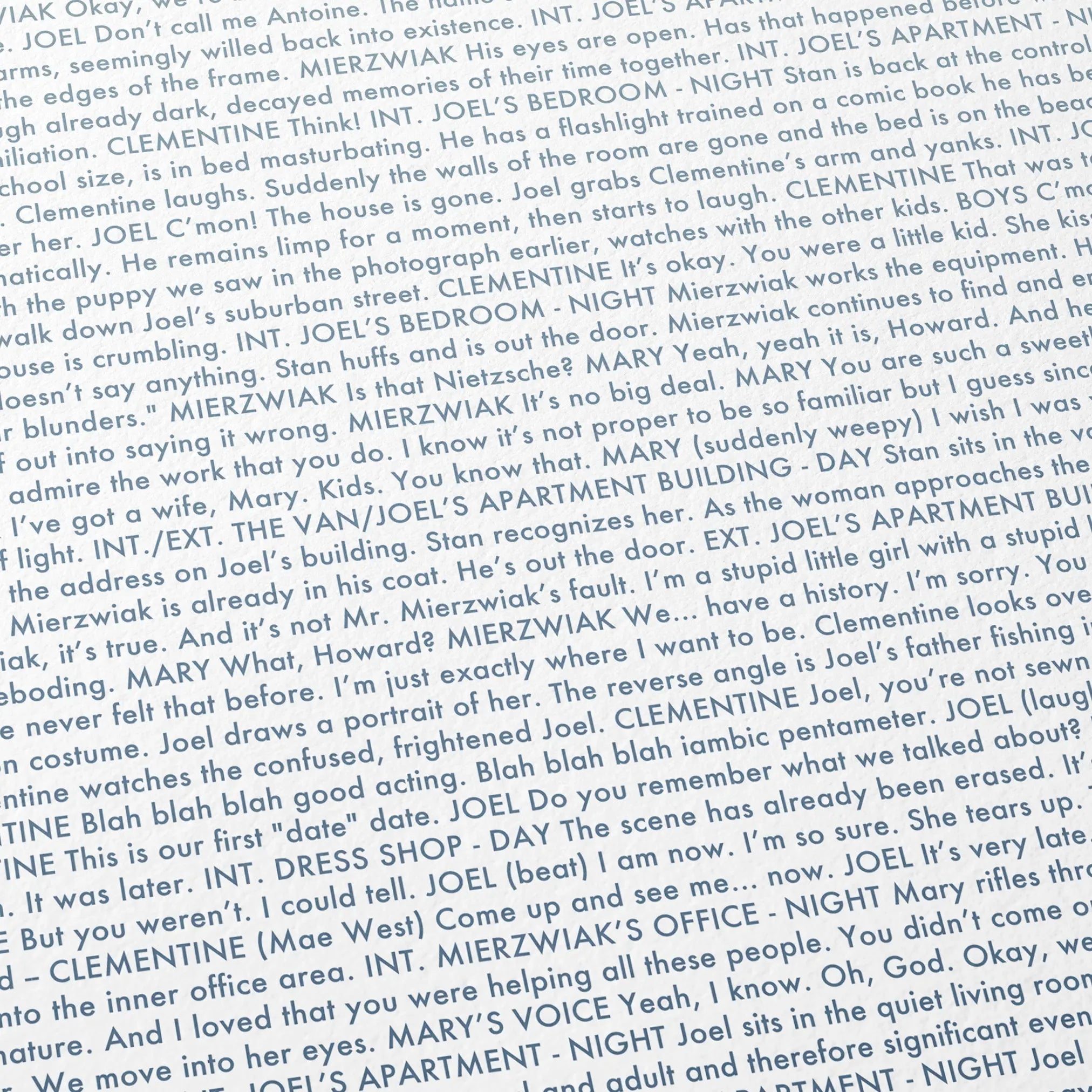 Close-up detail of the Eternal Sunshine of the Spotless Mind movie script poster showing dense typographic text.
