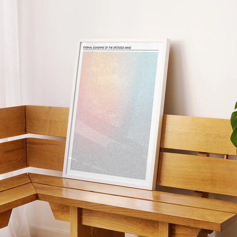 A framed Eternal Sunshine of the Spotless Mind movie script poster displayed on a sideboard in a contemporary space.
