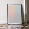 A framed Eternal Sunshine of the Spotless Mind movie script poster leaning against a wall in a minimalist interior.