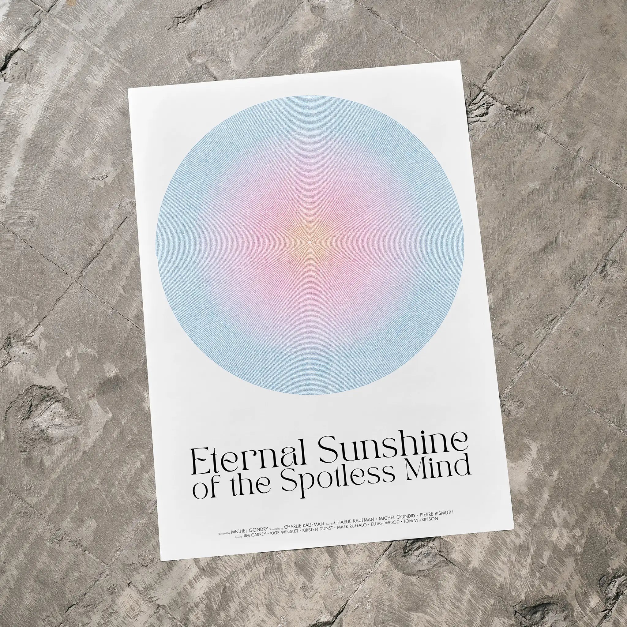 Eternal Sunshine of the Spotless Mind movie poster with a colorful circle design and text on a textured surface
