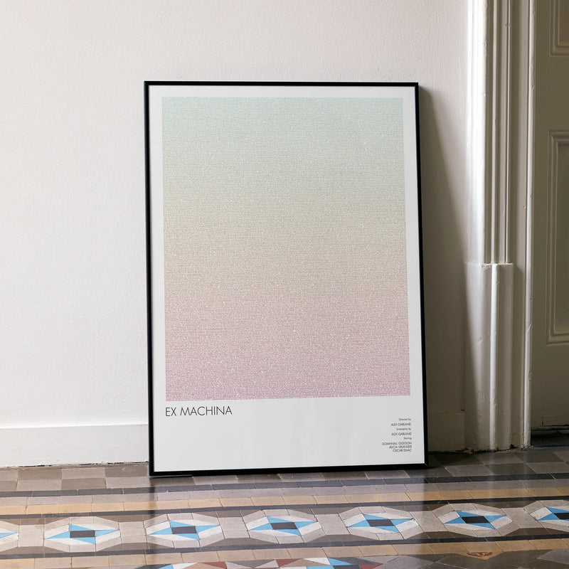 A framed Ex Machina movie script poster leaning against a wall in a minimalist interior.