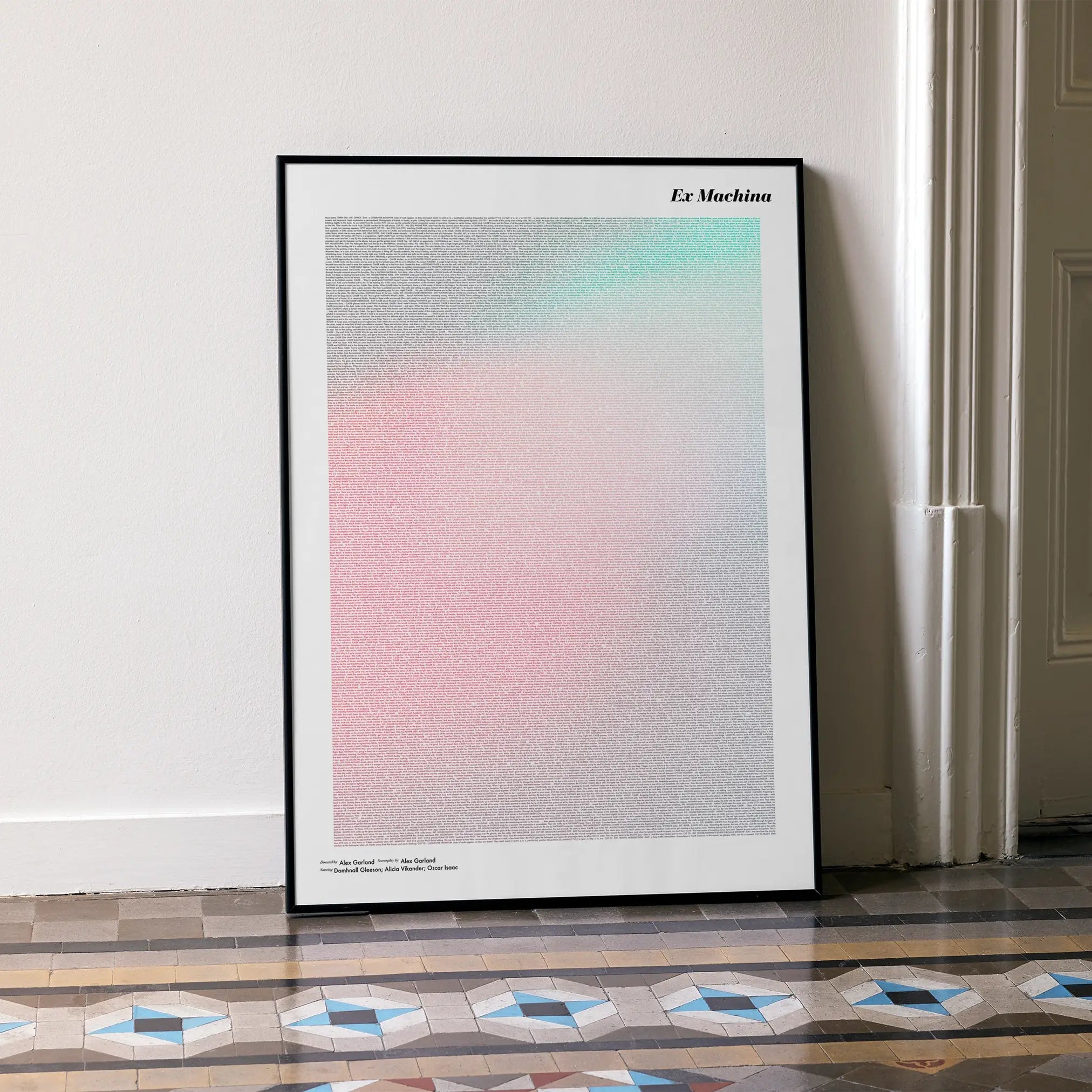 A framed Ex Machina movie script poster leaning against a wall in a minimalist interior.