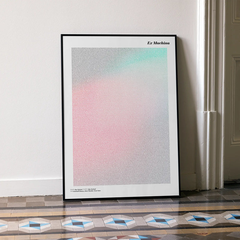 A framed Ex Machina movie script poster leaning against a wall in a minimalist interior.