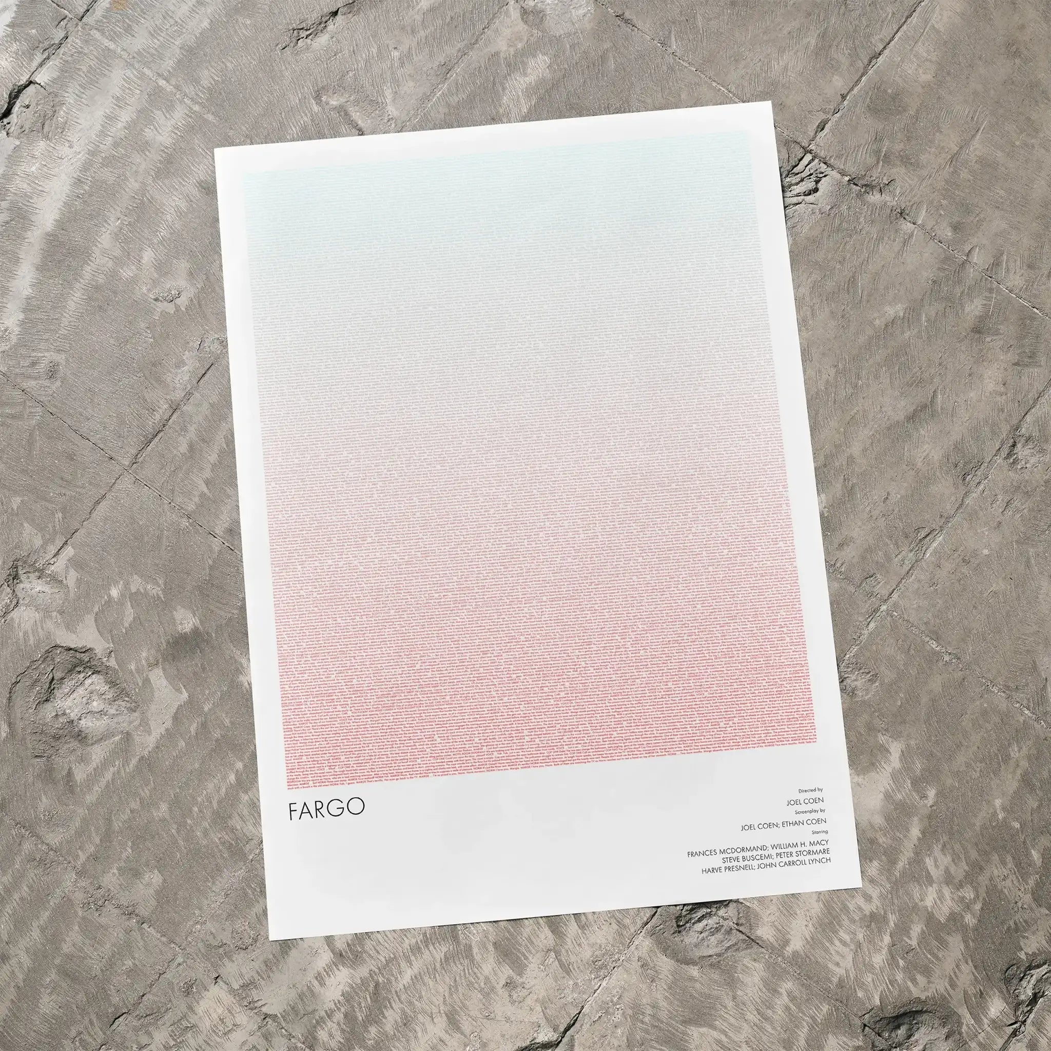 A Fargo movie script poster laid flat on a textured floor surface.