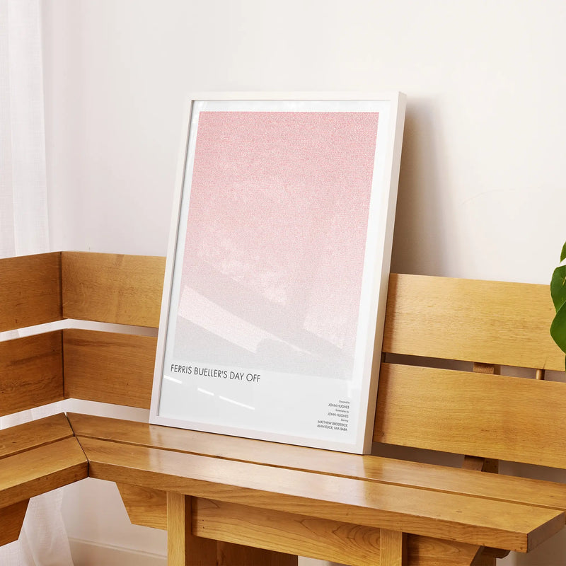 A framed Ferris Bueller’s Day Off movie script poster displayed on a sideboard in a contemporary space.