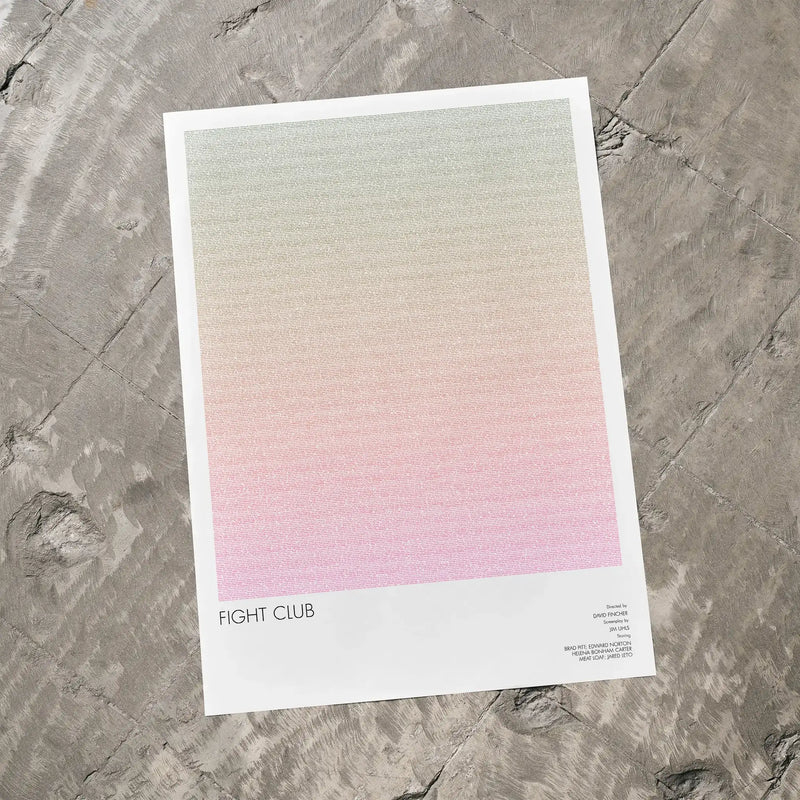 A Fight Club movie script poster laid flat on a textured floor surface.