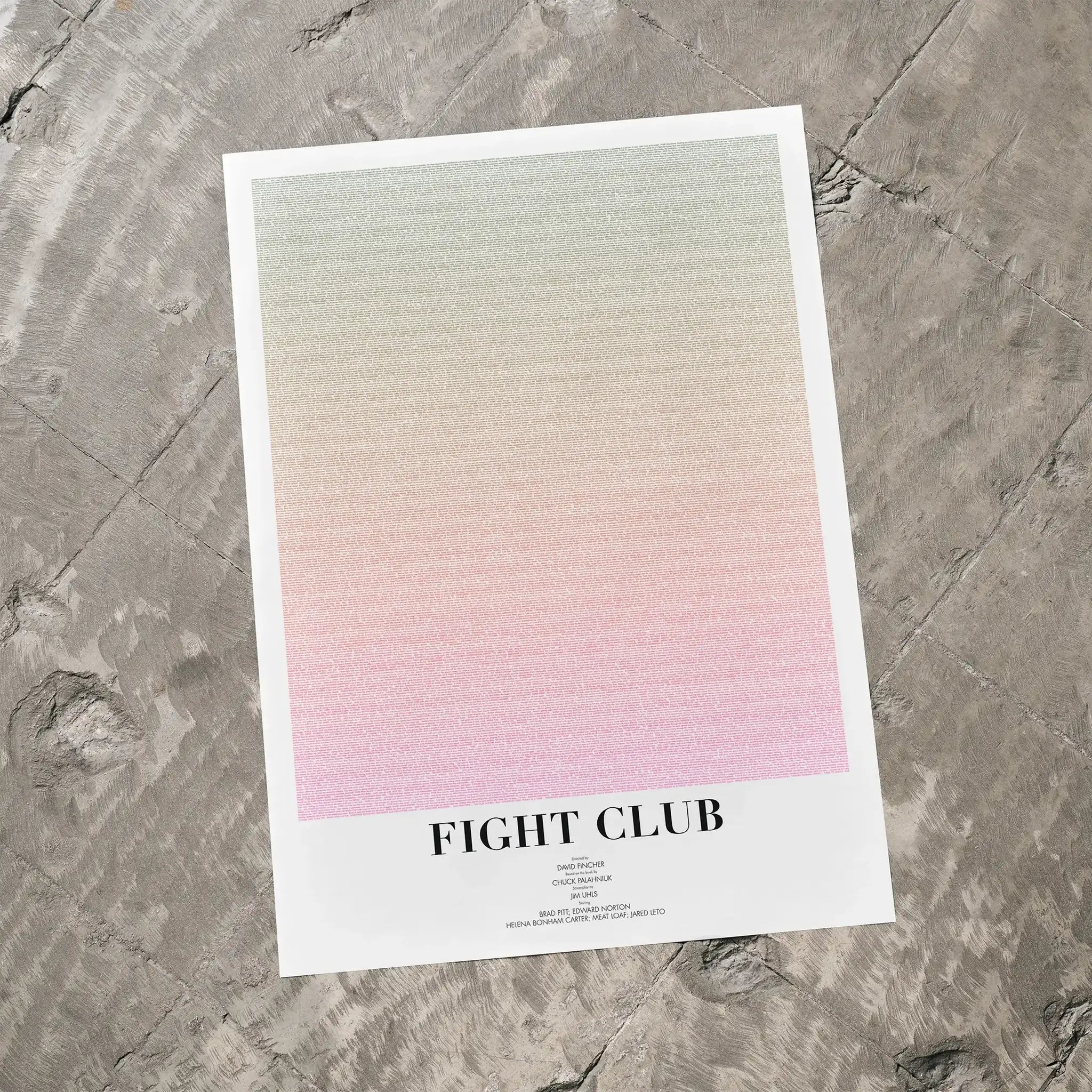 A Fight Club movie script poster laid flat on a textured floor surface.