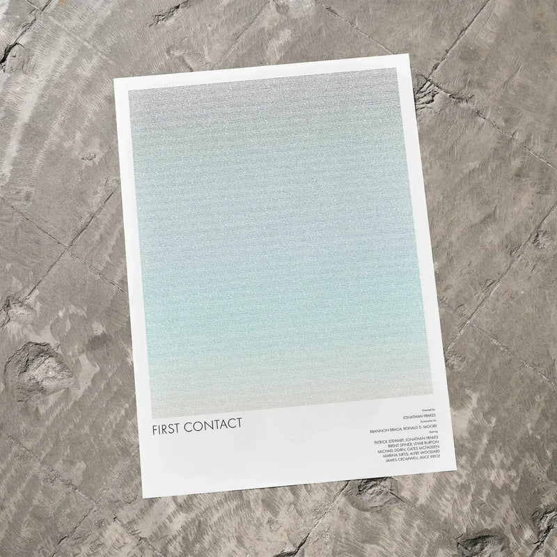 A Star Trek: First Contact movie script poster laid flat on a textured floor surface.