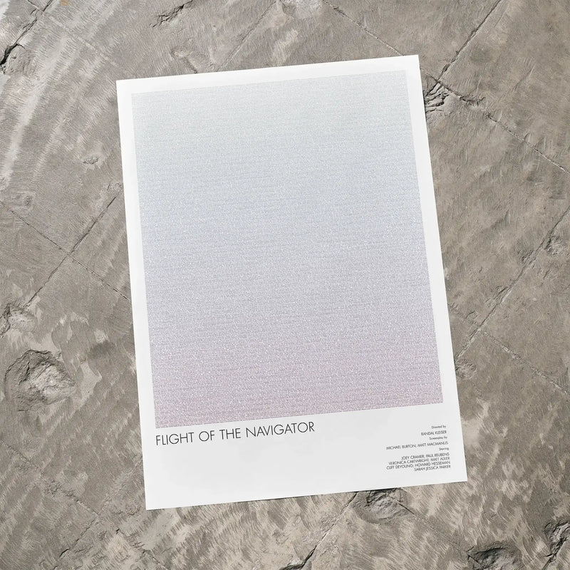 A Flight of the Navigator movie script poster laid flat on a textured floor surface.
