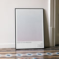 A framed Flight of the Navigator movie script poster leaning against a wall in a minimalist interior.
