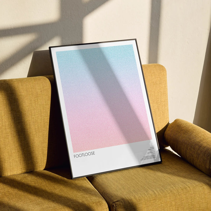 A framed Footloose movie script poster styled in a clean interior setting.