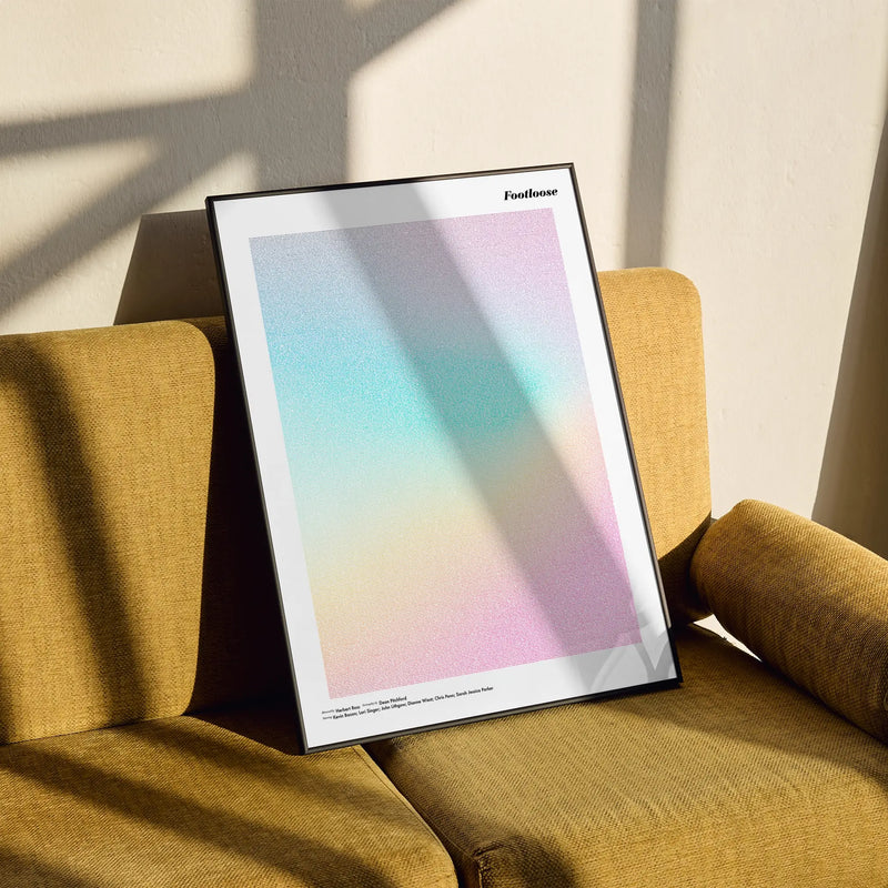 A framed Footloose movie script poster styled in a clean interior setting.