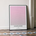 A framed Footloose movie script poster leaning against a wall in a minimalist interior.