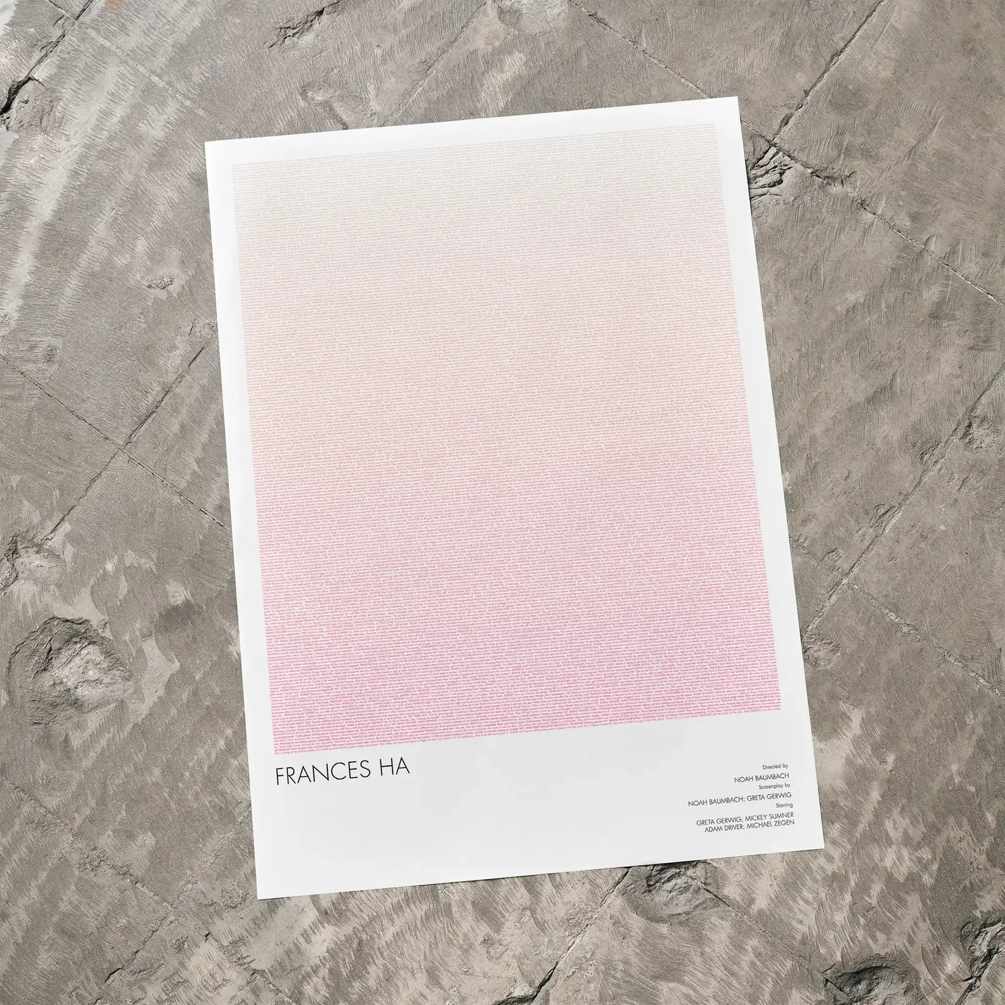 A Frances Ha movie script poster laid flat on a textured floor surface.