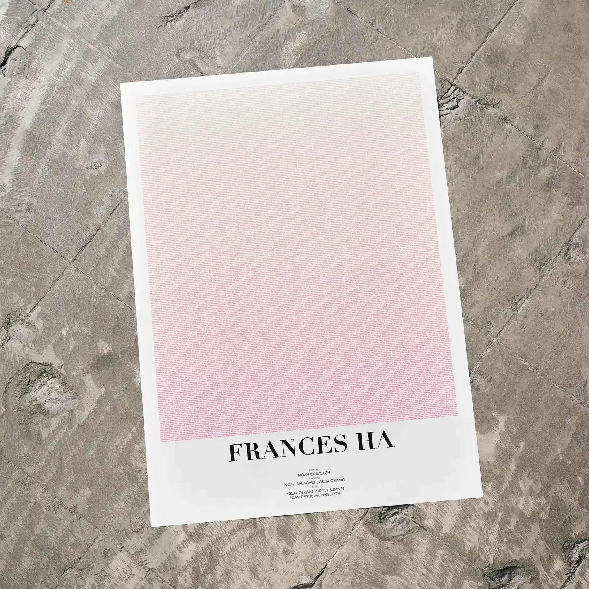 A Frances Ha movie script poster laid flat on a textured floor surface.