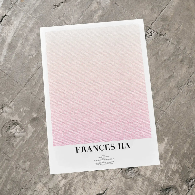 A Frances Ha movie script poster laid flat on a textured floor surface.