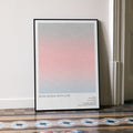 A framed From Russia with Love movie script poster leaning against a wall in a minimalist interior.