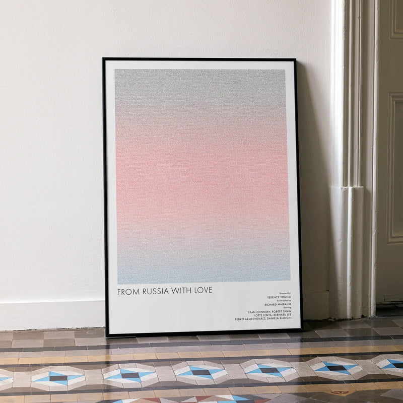 A framed From Russia with Love movie script poster leaning against a wall in a minimalist interior.
