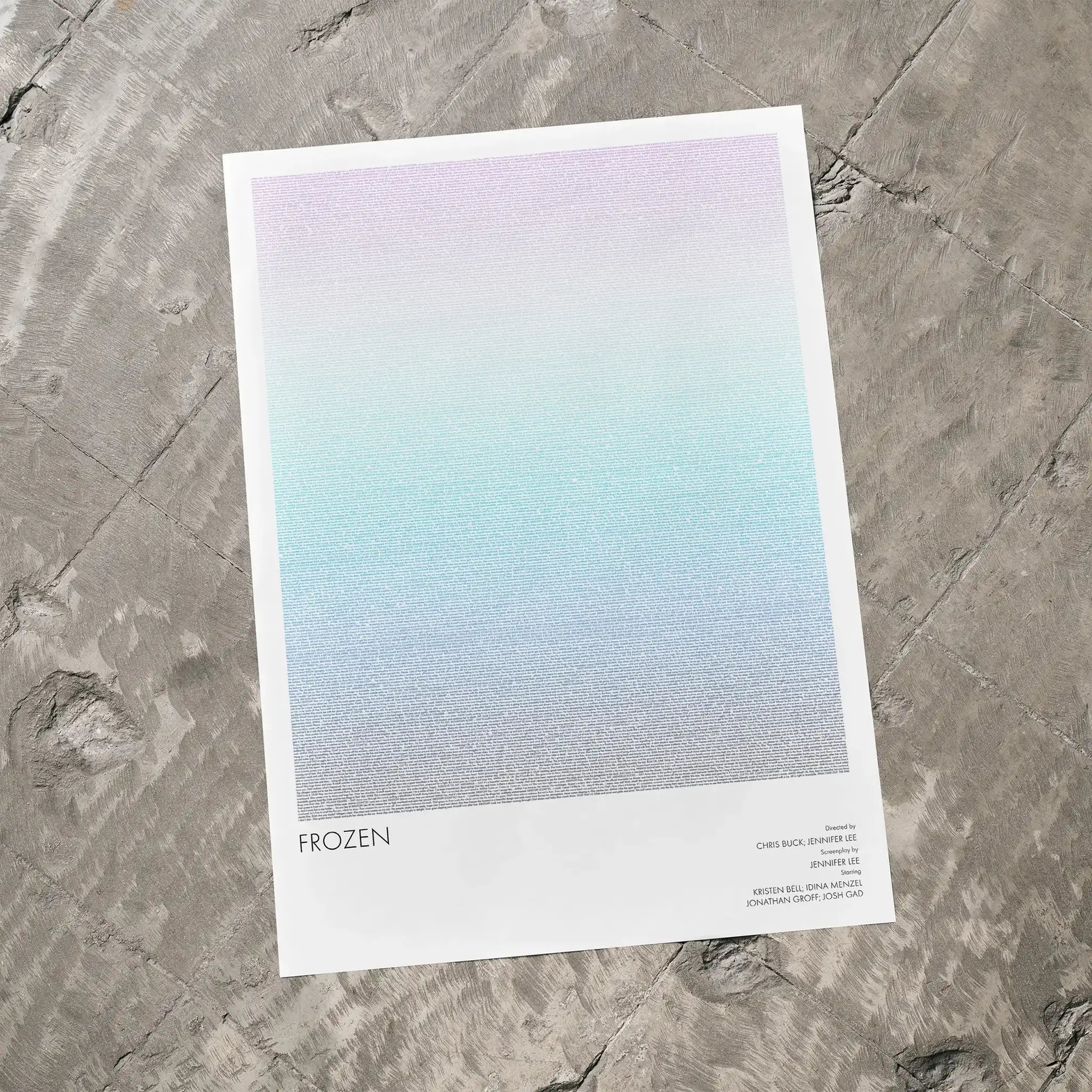A Frozen movie script poster laid flat on a textured floor surface.