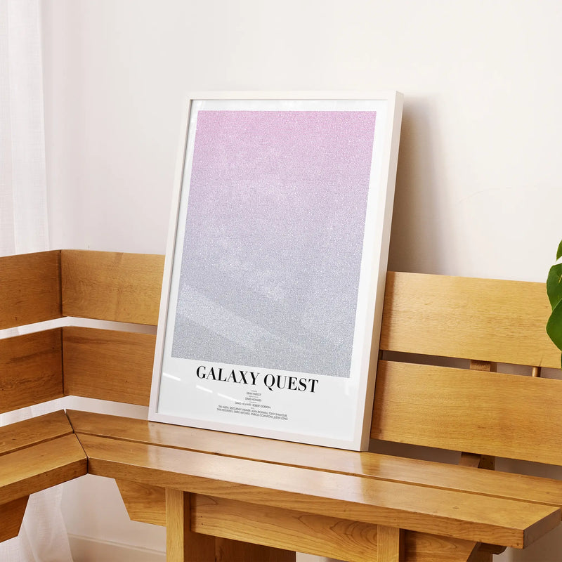 A framed Galaxy Quest movie script poster displayed on a sideboard in a contemporary space.