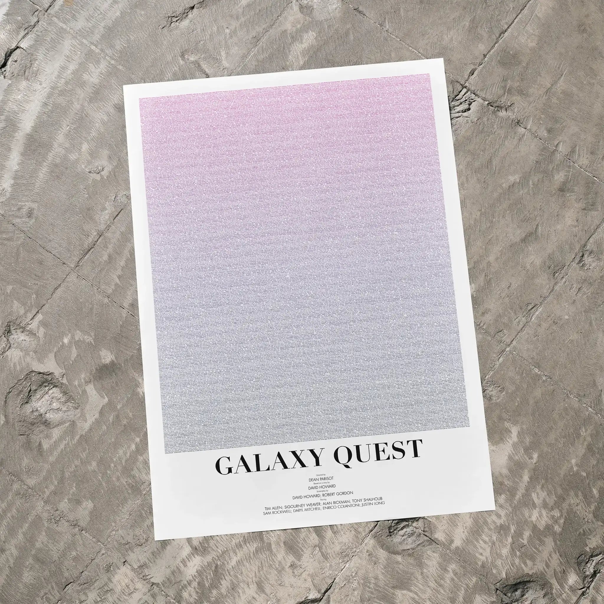 A Galaxy Quest movie script poster laid flat on a textured floor surface.