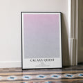 A framed Galaxy Quest movie script poster leaning against a wall in a minimalist interior.