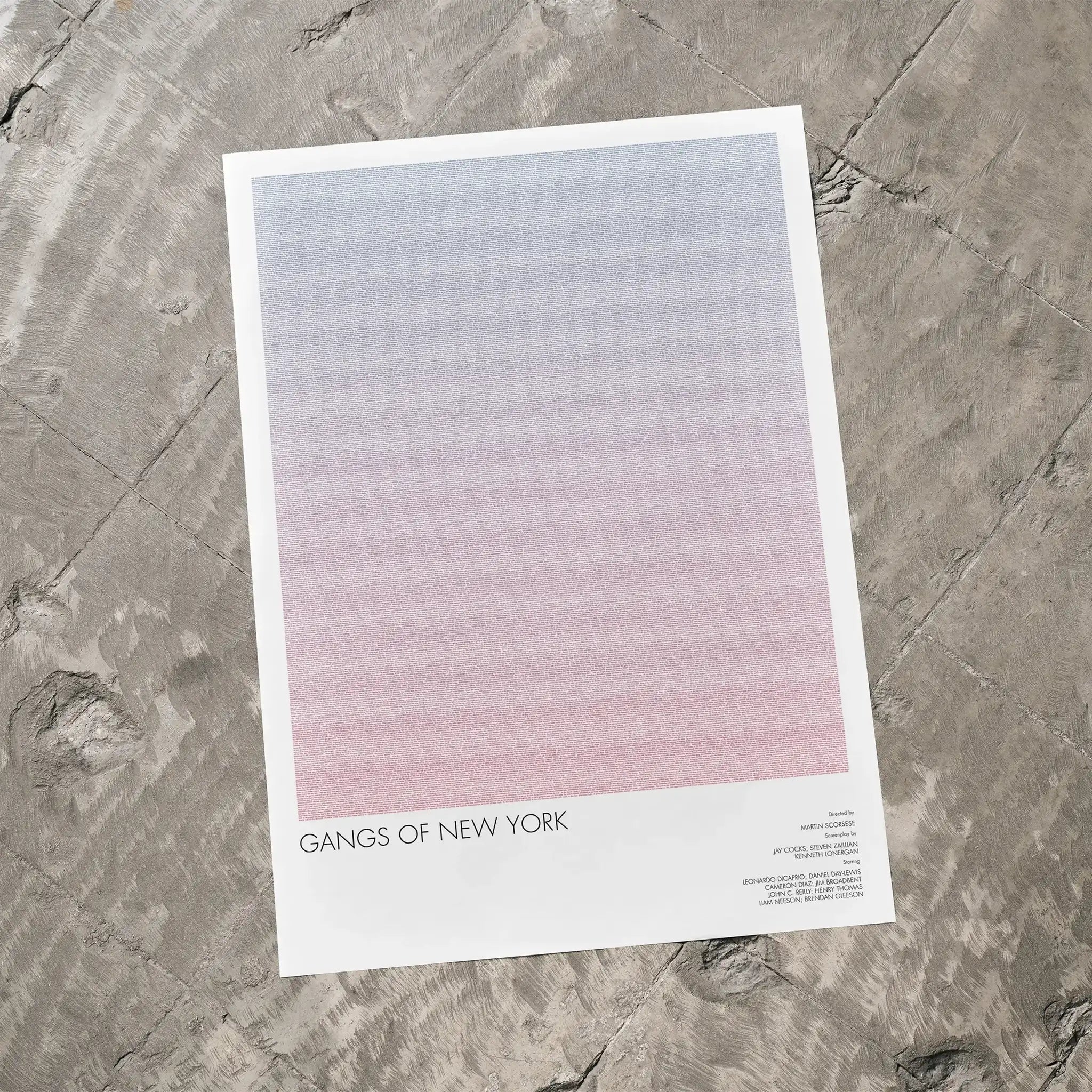 A Gangs of New York movie script poster laid flat on a textured floor surface.