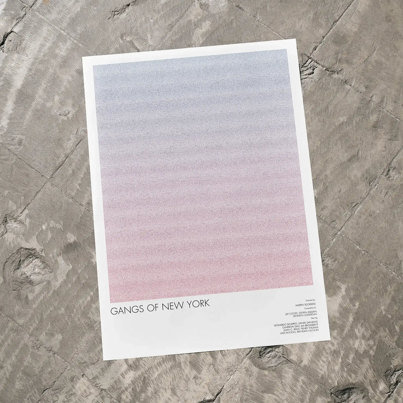 A Gangs of New York movie script poster laid flat on a textured floor surface.