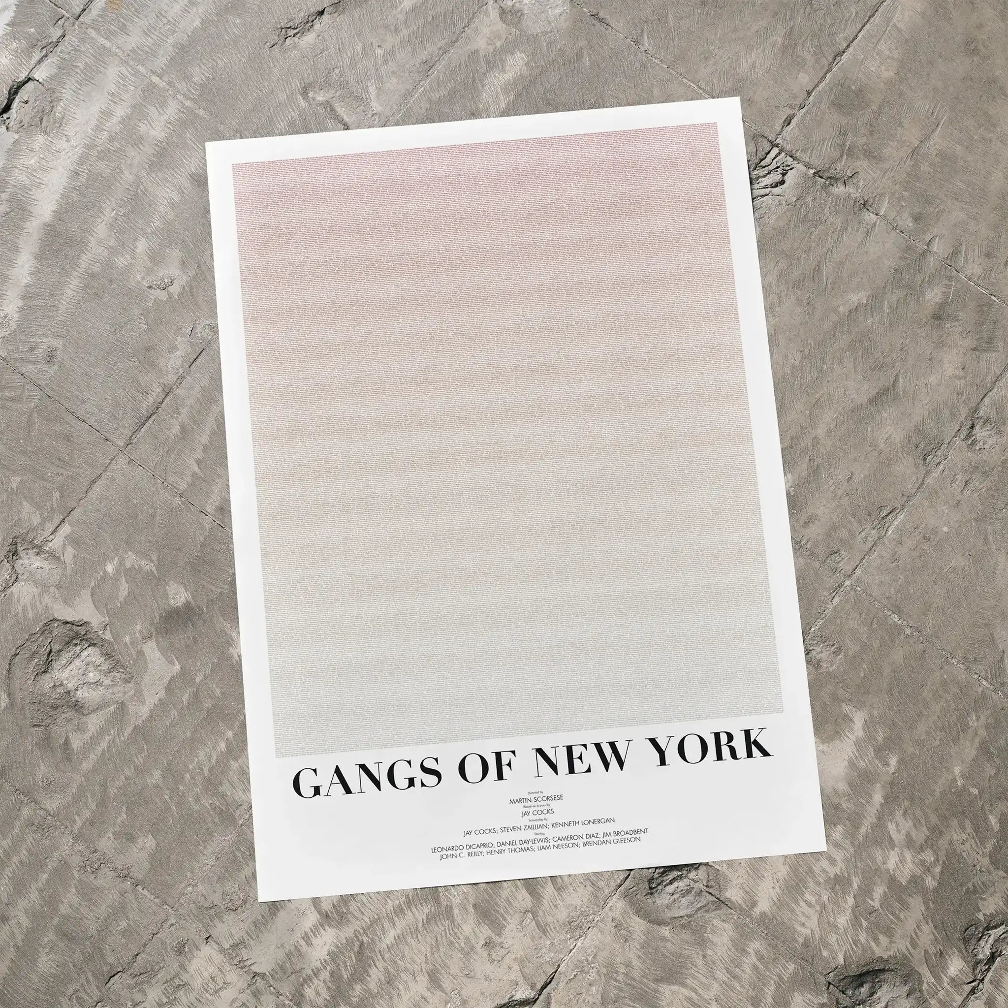 A Gangs of New York movie script poster laid flat on a textured floor surface.