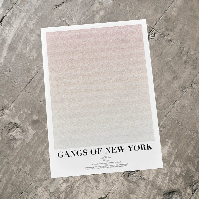 A Gangs of New York movie script poster laid flat on a textured floor surface.