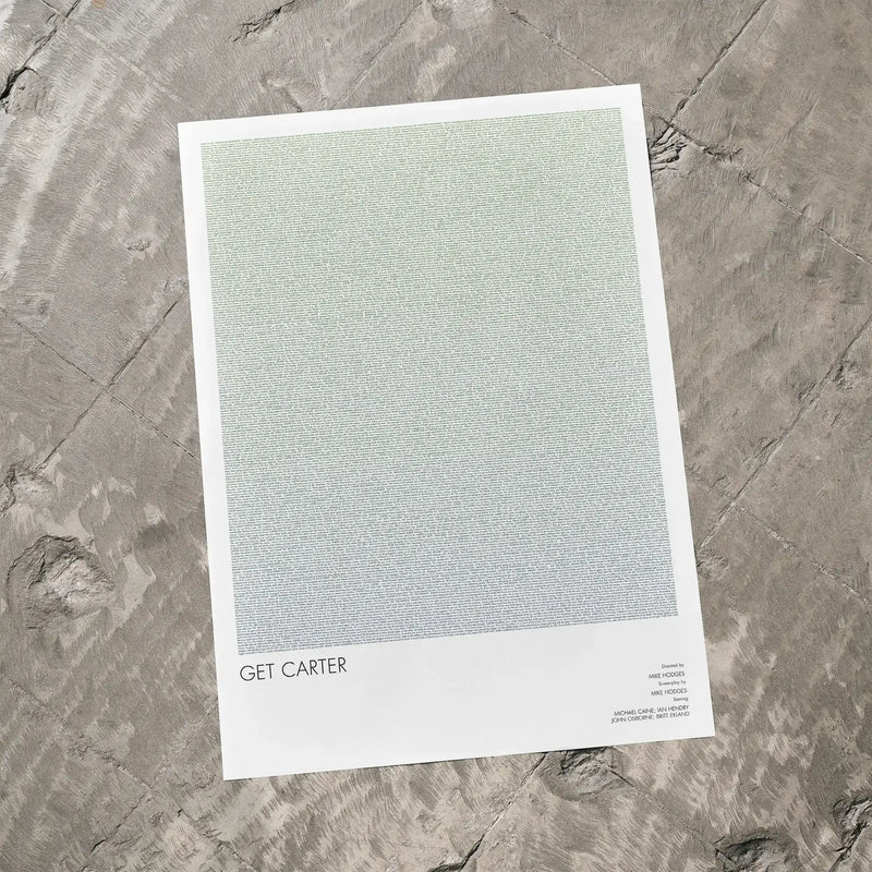 A Get Carter movie script poster laid flat on a textured floor surface.