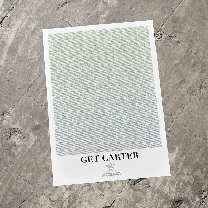 A Get Carter movie script poster laid flat on a textured floor surface.