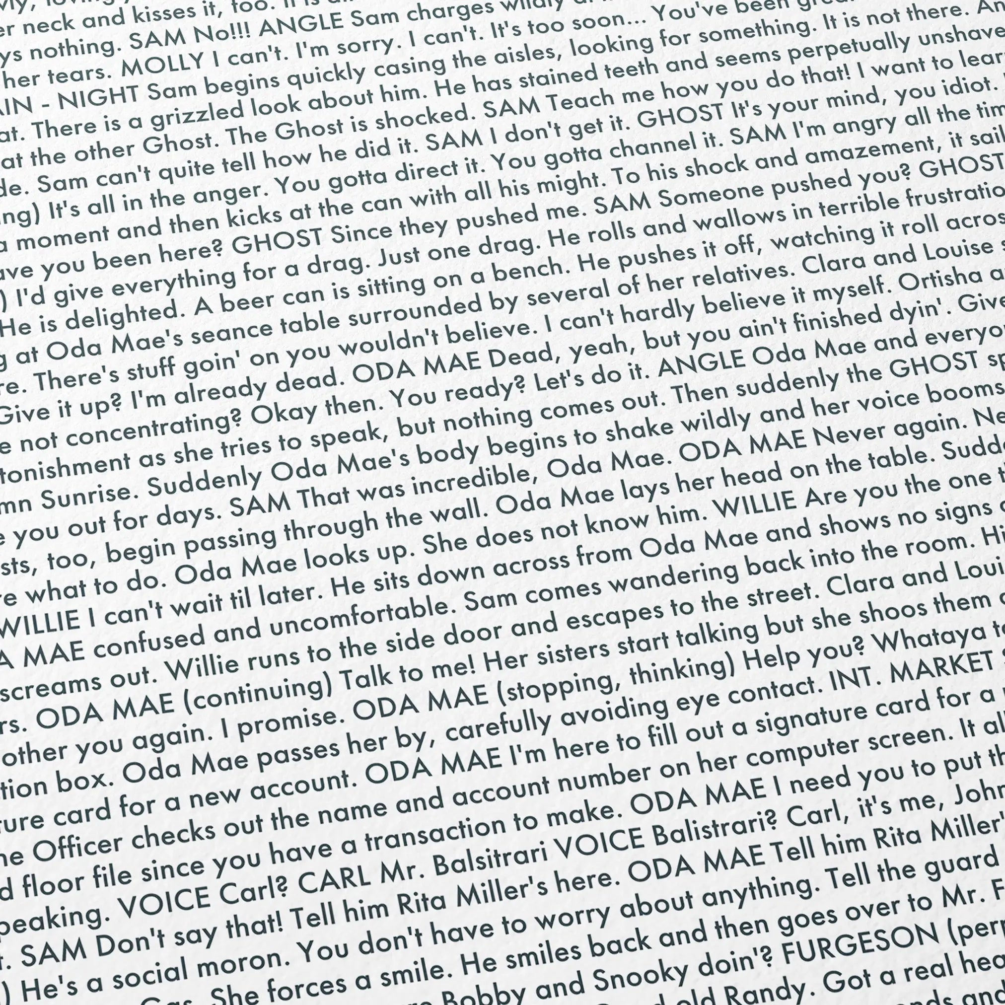 Close-up detail of the Ghost movie script poster showing dense typographic text.