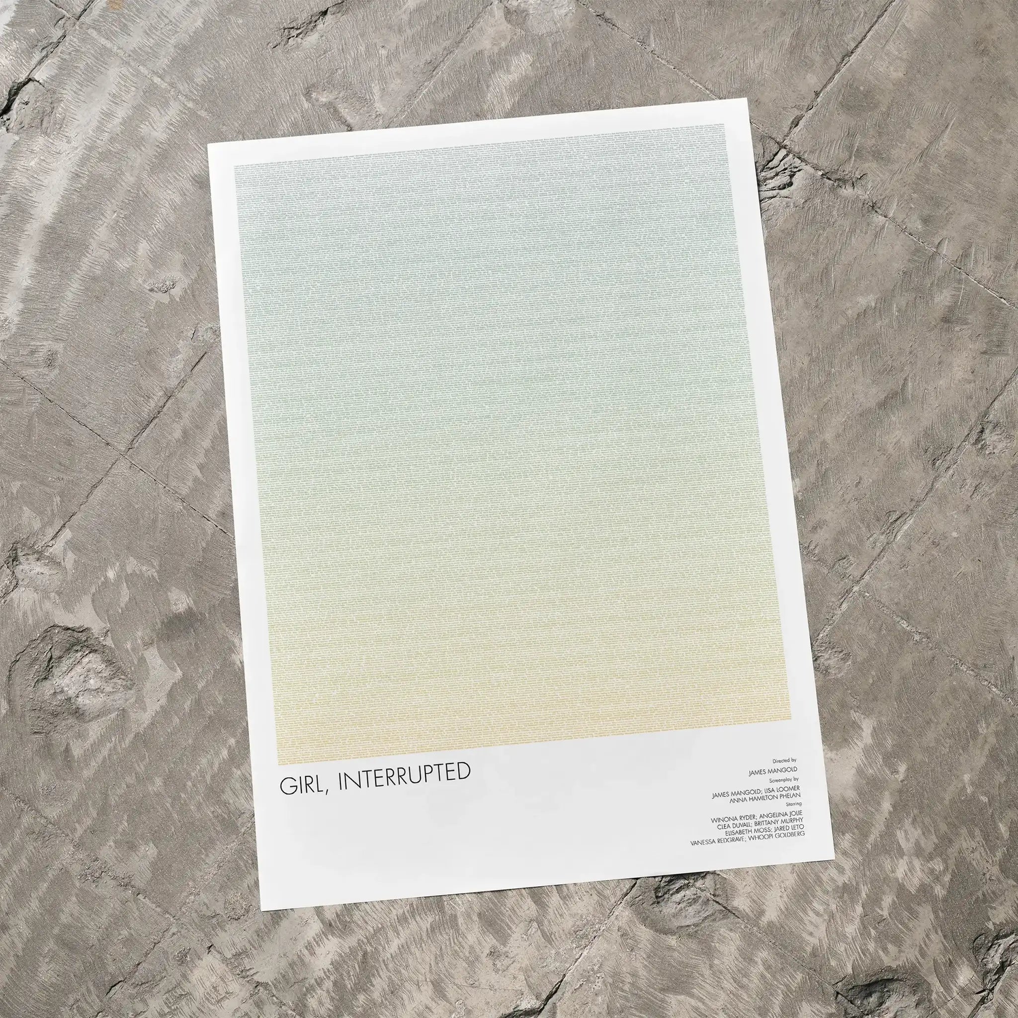A Girl, Interrupted movie script poster laid flat on a textured floor surface.