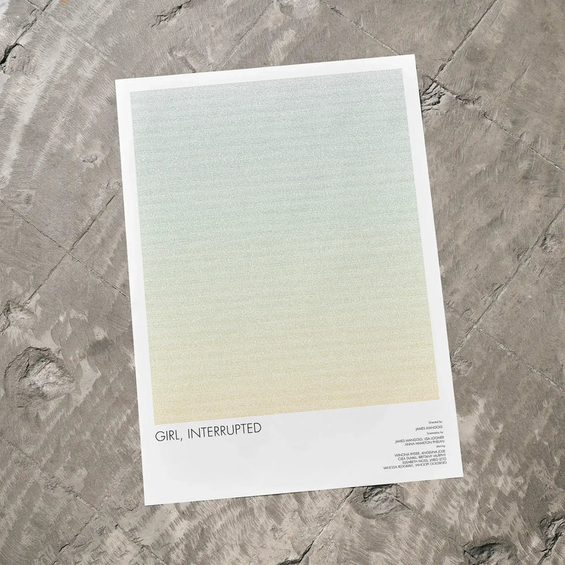 A Girl, Interrupted movie script poster laid flat on a textured floor surface.