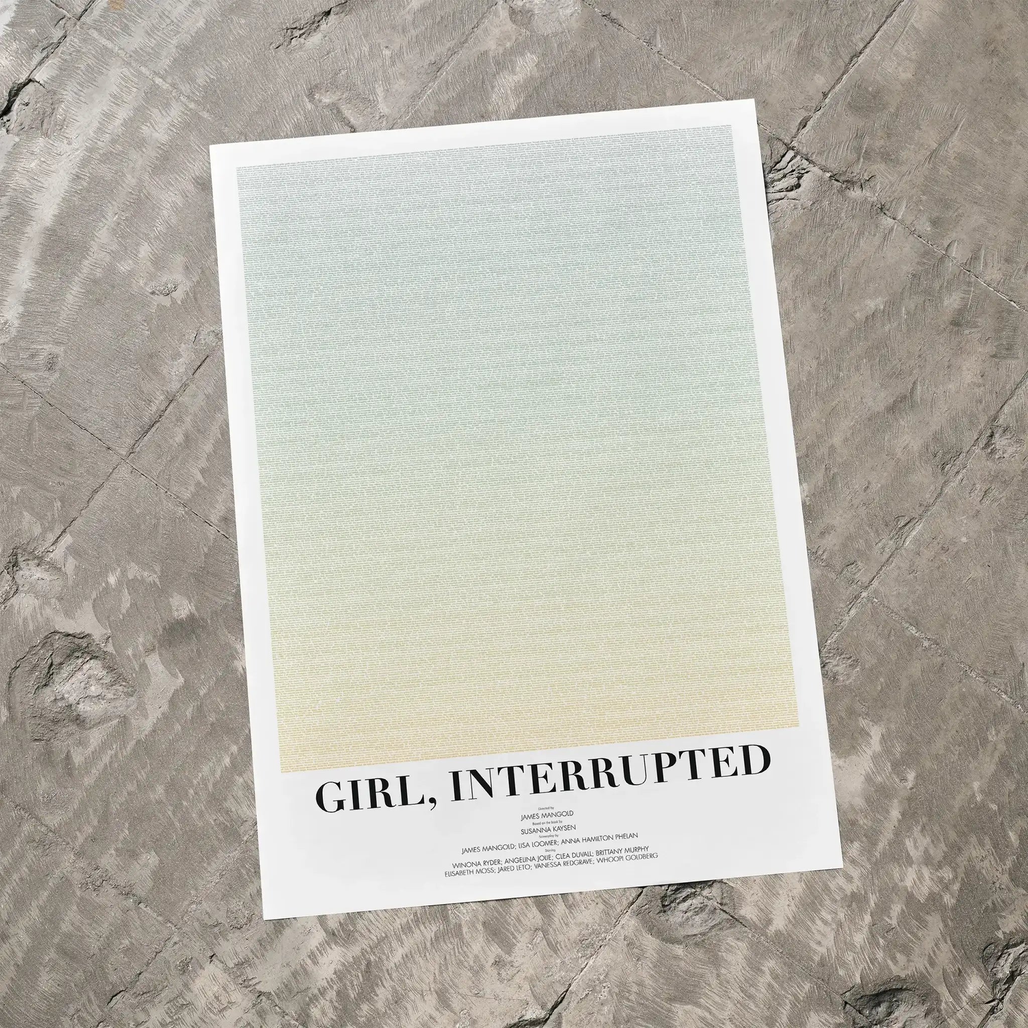 A Girl, Interrupted movie script poster laid flat on a textured floor surface.