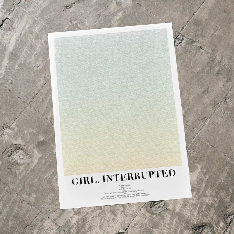 A Girl, Interrupted movie script poster laid flat on a textured floor surface.