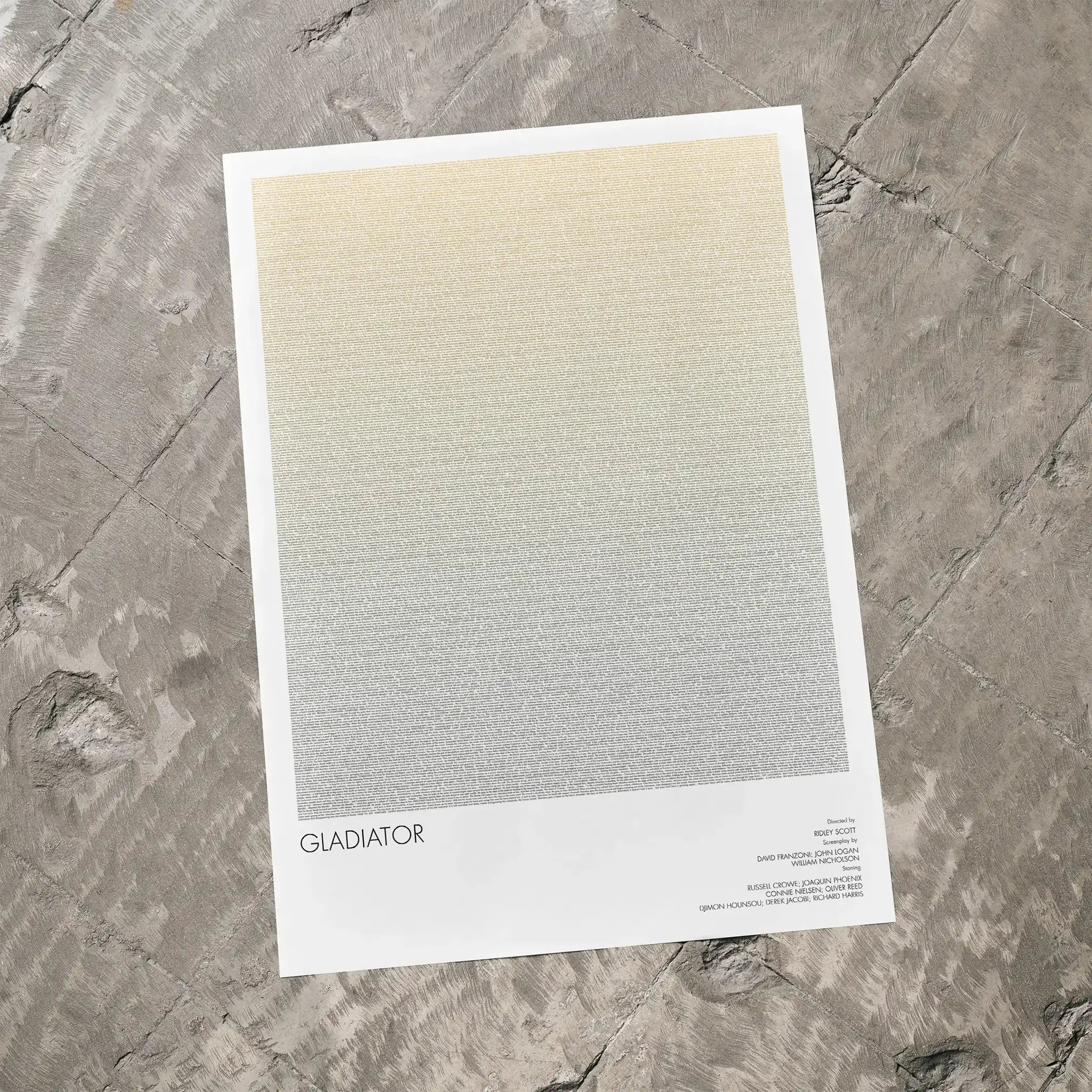 A Gladiator movie script poster laid flat on a textured floor surface.