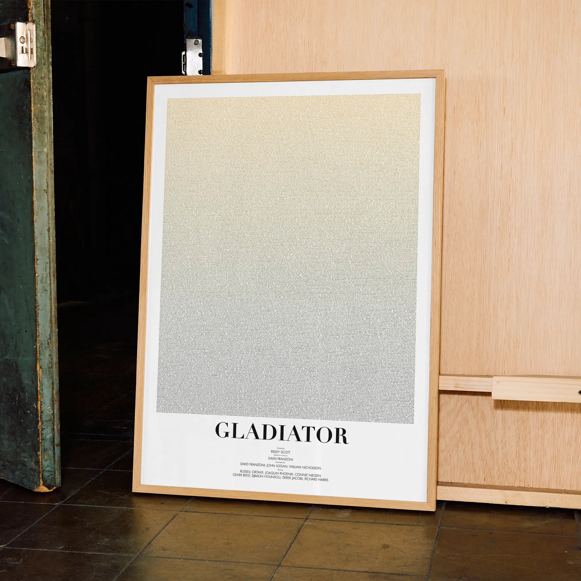 A framed Gladiator movie script poster displayed in a contemporary interior setting.