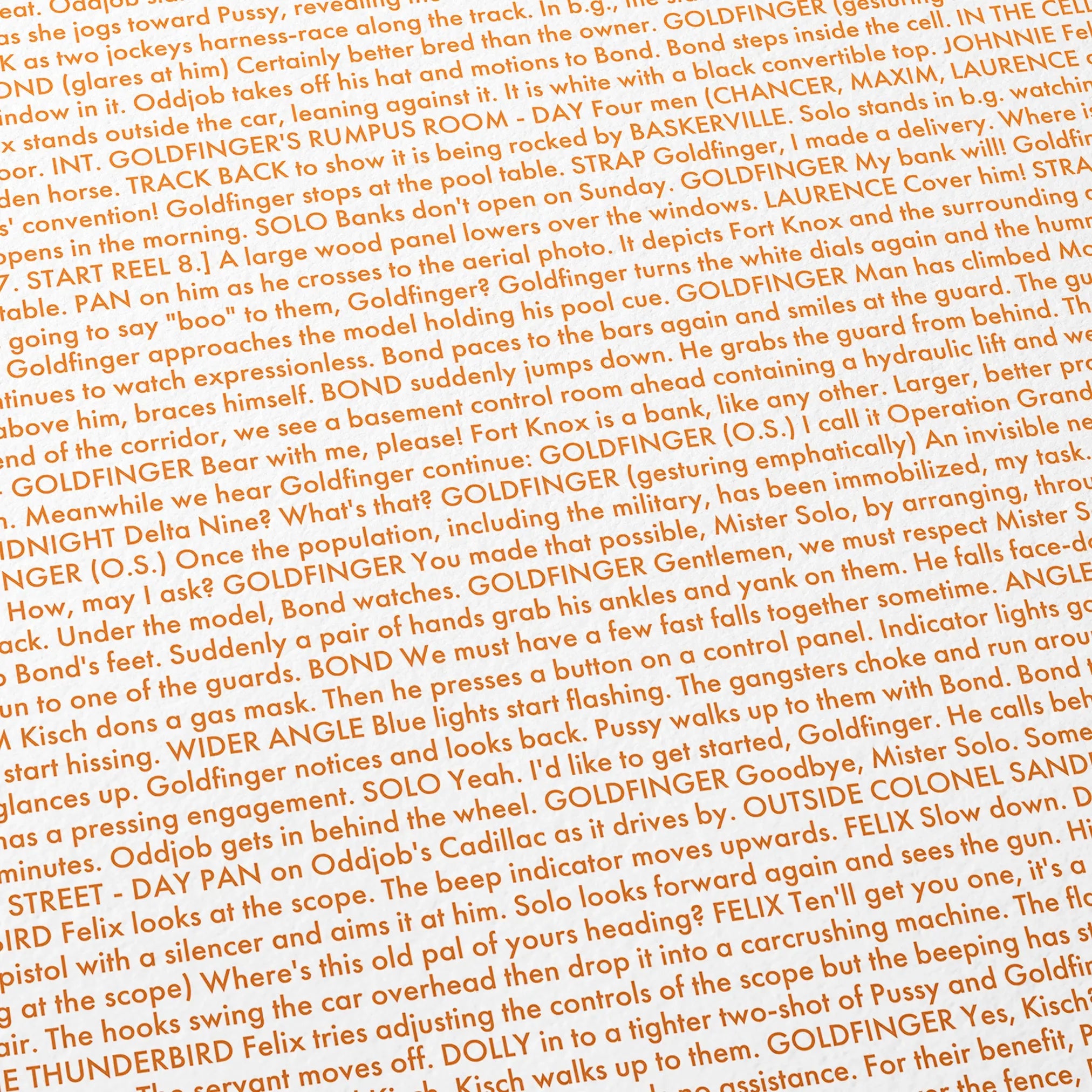 Close-up detail of the Goldfinger movie script poster showing dense typographic text.