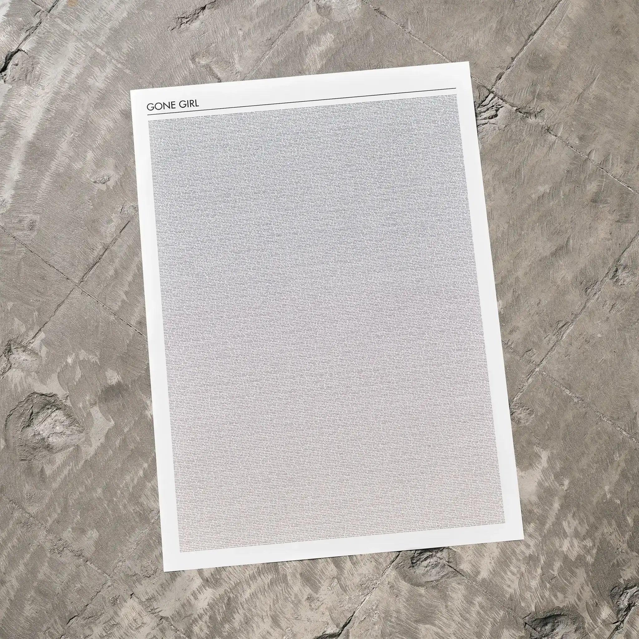 A Gone Girl movie script poster laid flat on a textured floor surface.