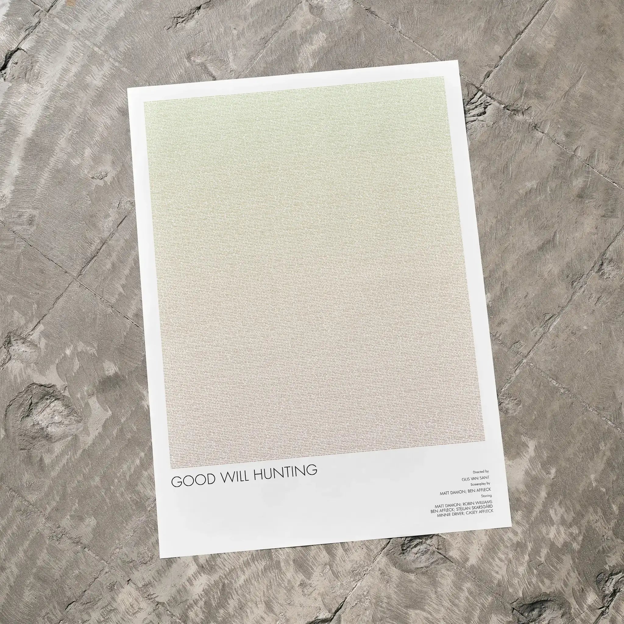 A Good Will Hunting movie script poster laid flat on a textured floor surface.