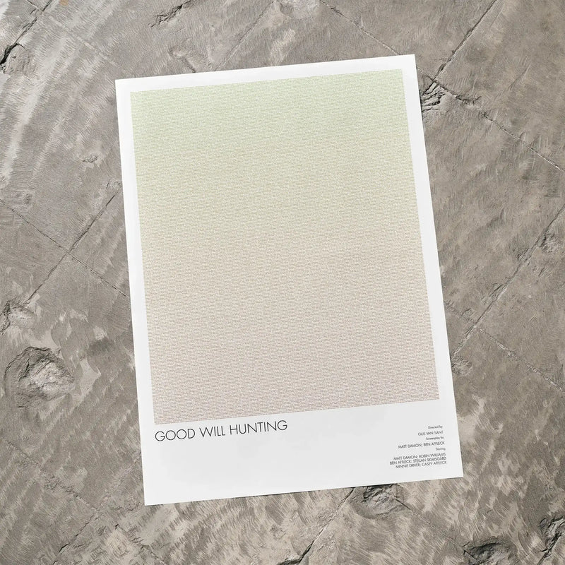 A Good Will Hunting movie script poster laid flat on a textured floor surface.
