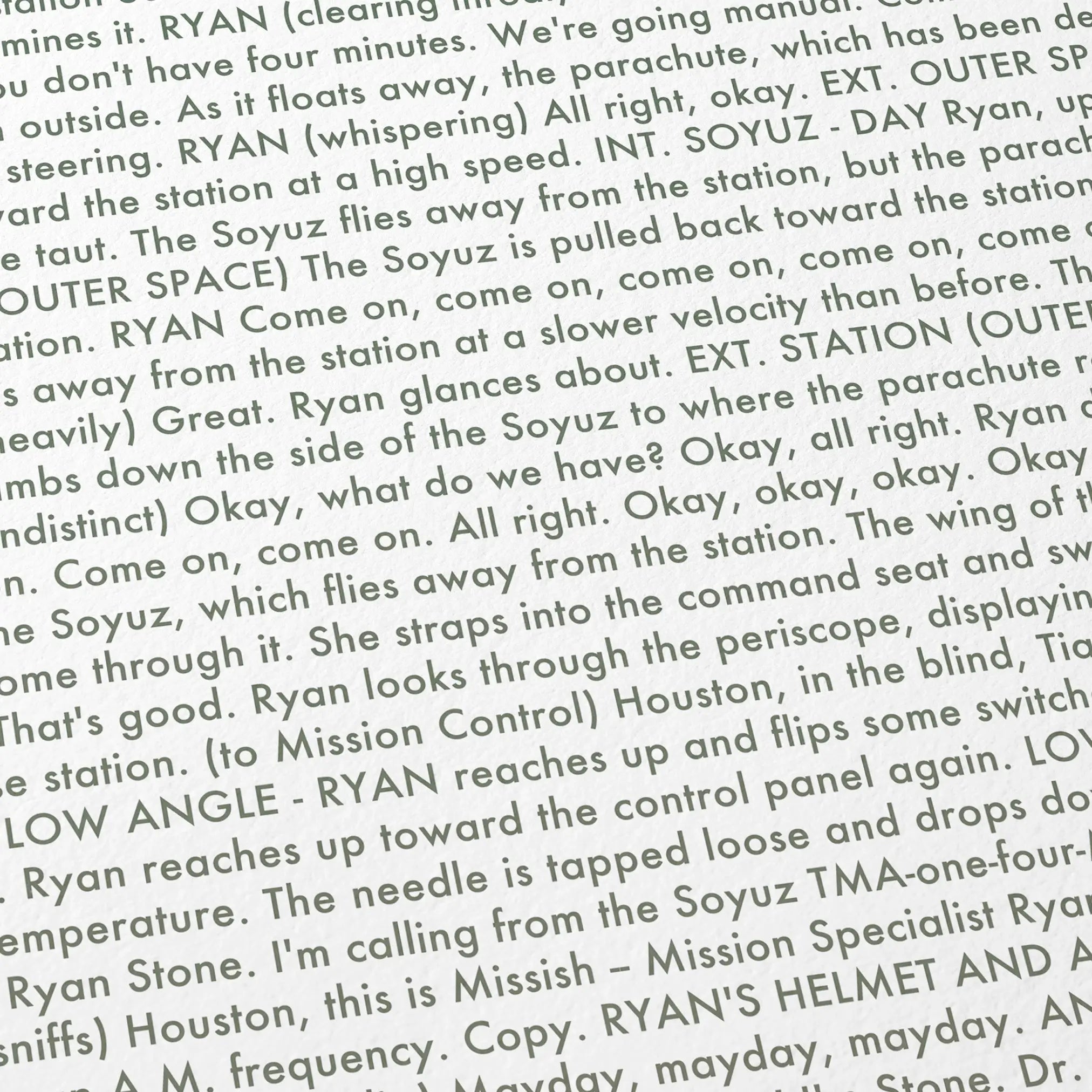 Close-up detail of the Gravity movie script poster showing dense typographic text.