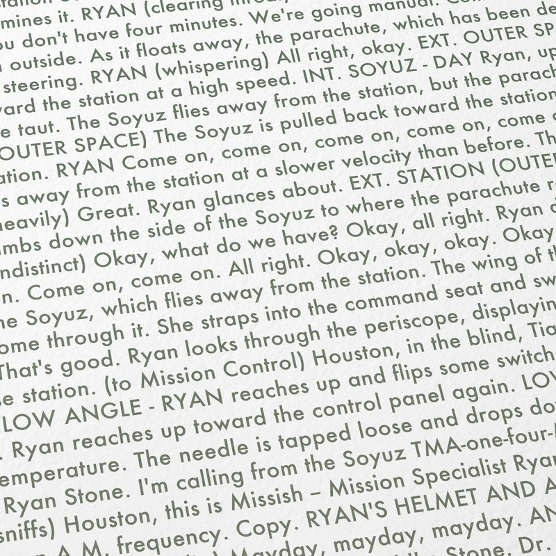 Close-up detail of the Gravity movie script poster showing dense typographic text.